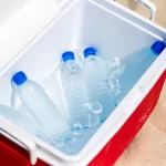 bottles-water-ice-box-beach_397170-12